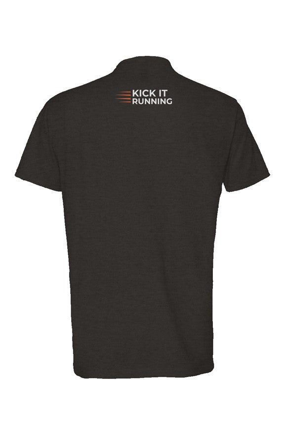back of black shirt with four orange speed lines vertically stacked to the left followed by 'Kick It Running' text in white