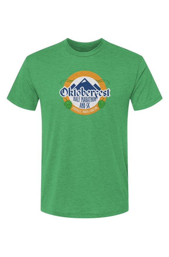 green t-shirt with Oktoberfest Half Marathon & 5k logo with blue mountains, green hops in a gold ring on a white background