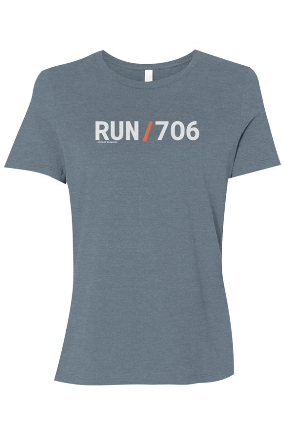 light blue t-shirt with words RUN / 706 in white with orange slash separating the words