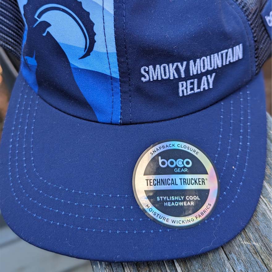 Blue cap with 'Smoky Mountain Relay' text and BOCO Gear label on a wooden surface