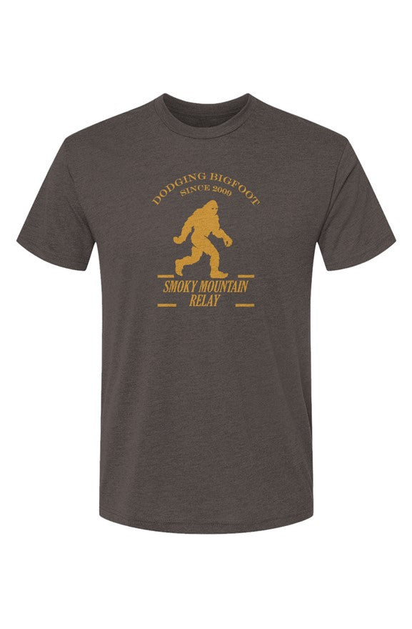 Dark gray t-shirt with yellow SMR Bigfoot graphic and text on a white background