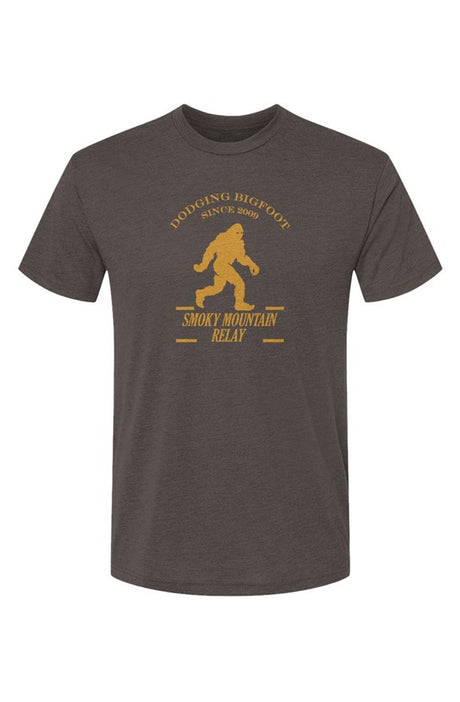 Dark gray t-shirt with yellow SMR Bigfoot graphic and text on a white background