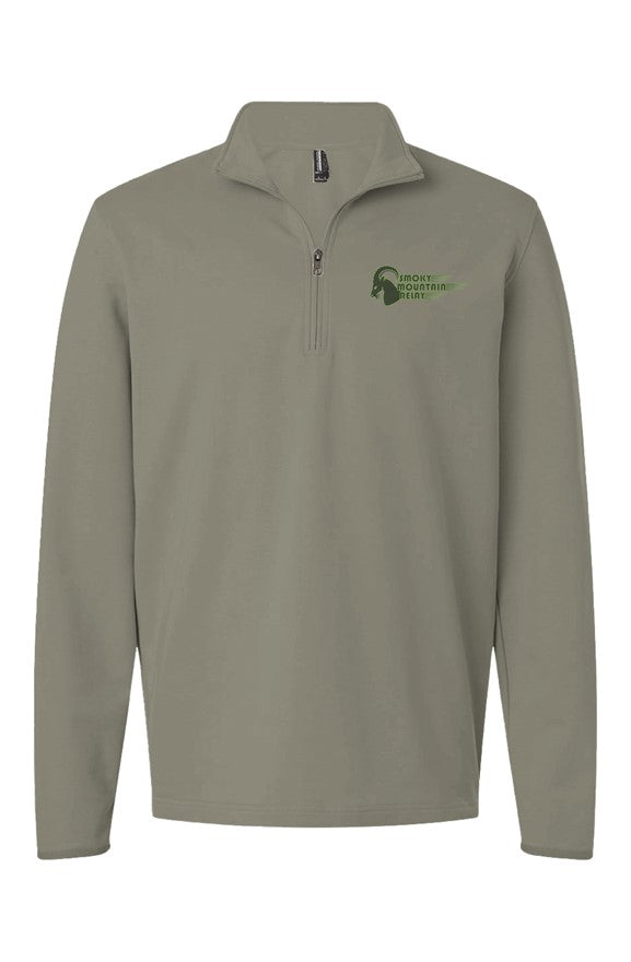 Light Green performance quarter zip with an green SMR ram logo on the chest against a white background