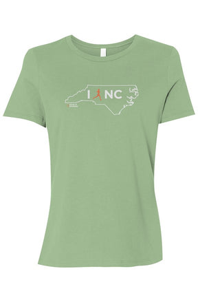 light green t-shirt with white North Carolina outline graphic surrounding 'I RUN NC' text with the word 'RUN' replaced by a silhouetted female runner in orange