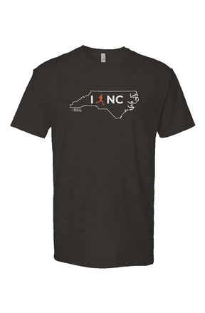 black t-shirt with white North Carolina outline graphic surrounding 'I RUN NC' text with the word 'RUN' replaced by a silhouetted male runner in orange