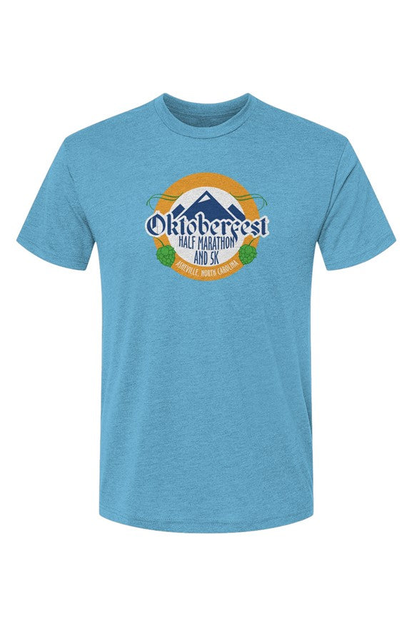 blue t-shirt with Oktoberfest Half Marathon & 5k logo with blue mountains, green hops in a gold ring on a white background