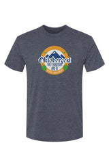 slate blue t-shirt with Oktoberfest Half Marathon & 5k logo with blue mountains, green hops in a gold ring on a white background
