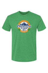 green t-shirt with Oktoberfest Half Marathon & 5k logo with blue mountains, green hops in a gold ring on a white background