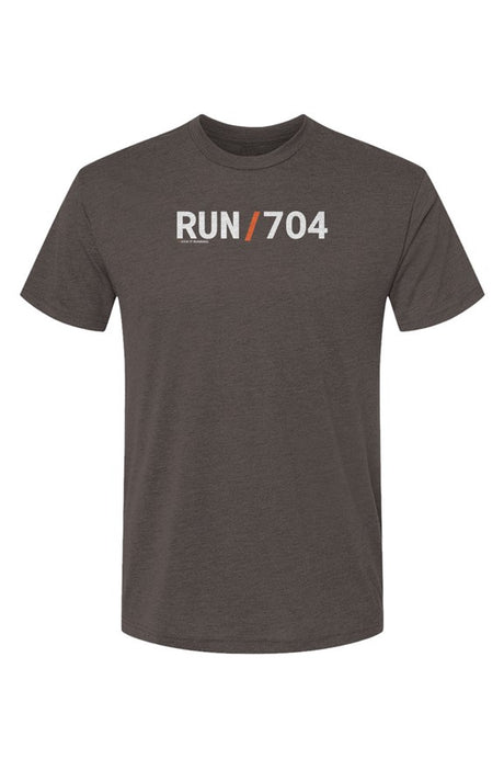 brown shirt with words RUN / 704 in white with orange slash separating the words