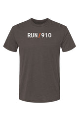 brown shirt with words RUN / 910 in white with orange slash separating the words