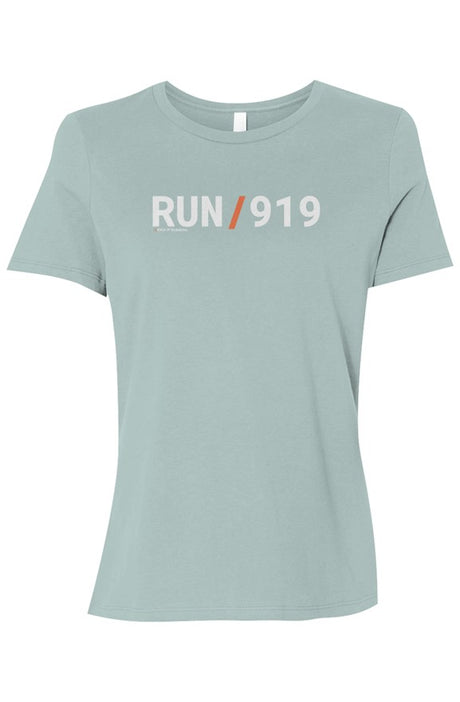 light blue shirt with words RUN / 919 in white with orange slash separating the words
