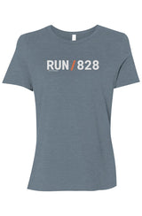 light blue shirt with words RUN / 828 in white with orange slash separating the words