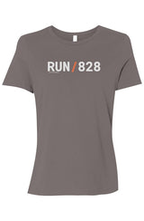 light grey shirt with words RUN / 828 in white with orange slash separating the words