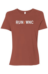 brown shirt with words RUN / WNC in white with orange slash separating the words