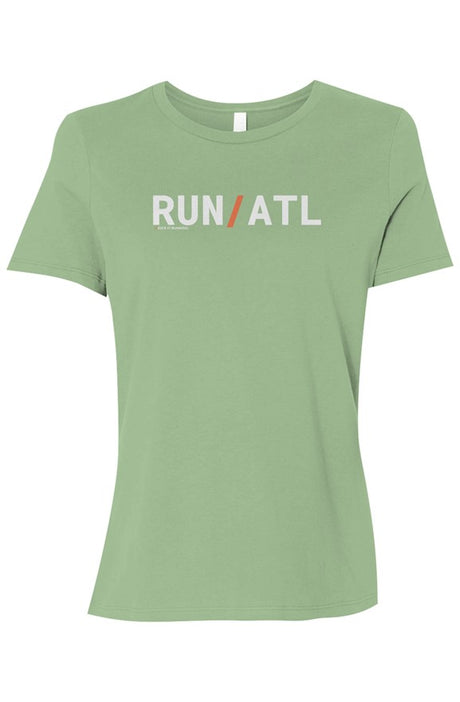light green t-shirt with words RUN / ATL in white with orange slash separating the words