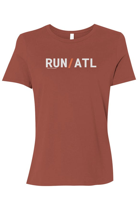 dark orange t-shirt with words RUN / ATL in white with orange slash separating the words