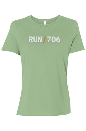 light green t-shirt with words RUN / 706 in white with orange slash separating the words
