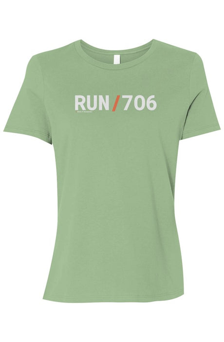 light green t-shirt with words RUN / 706 in white with orange slash separating the words