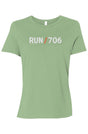 light green t-shirt with words RUN / 706 in white with orange slash separating the words