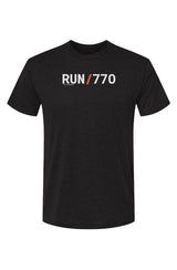 dark grey t-shirt with words RUN / 770 in white with orange slash separating the words