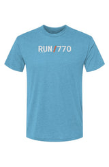 blue t-shirt with words RUN / 770 in white with orange slash separating the words