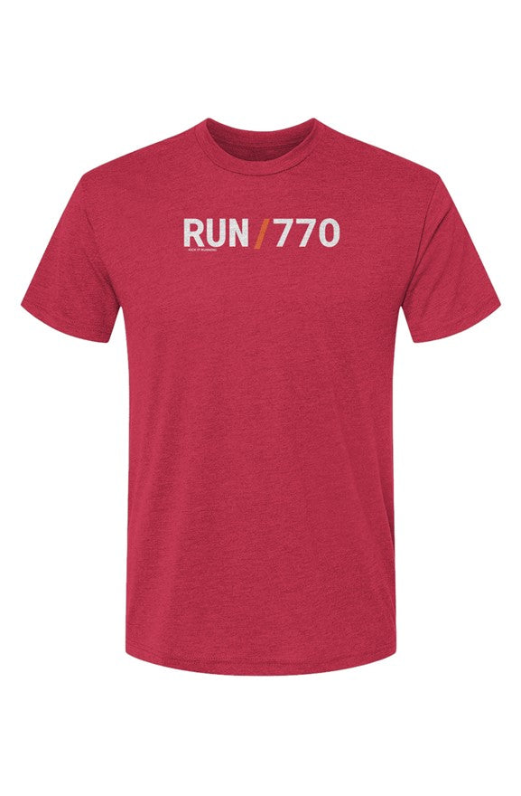 red t-shirt with words RUN / 770 in white with orange slash separating the words