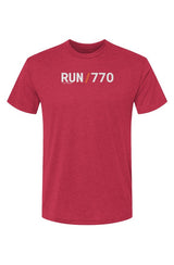 red t-shirt with words RUN / 770 in white with orange slash separating the words