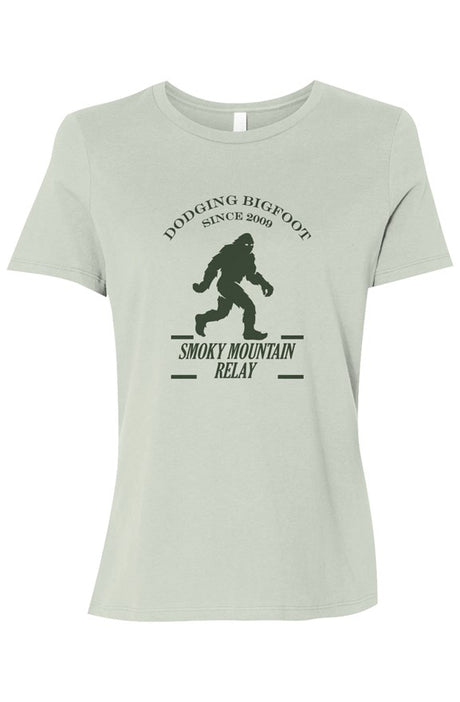 Light green t-shirt with a dark green graphic of Bigfoot and Smoky Mountain Relay in text below it