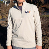Person wearing a light gray pullover with a Smoky Mountain Relay speed ram logo on the chest outdoors.