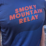 Blue shirt with 'Smoky Mountain Relay' text in orange on a person.